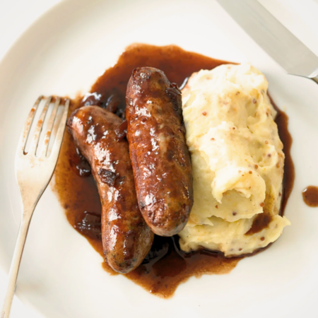 Bangers with caramelised red onions and mustard mash